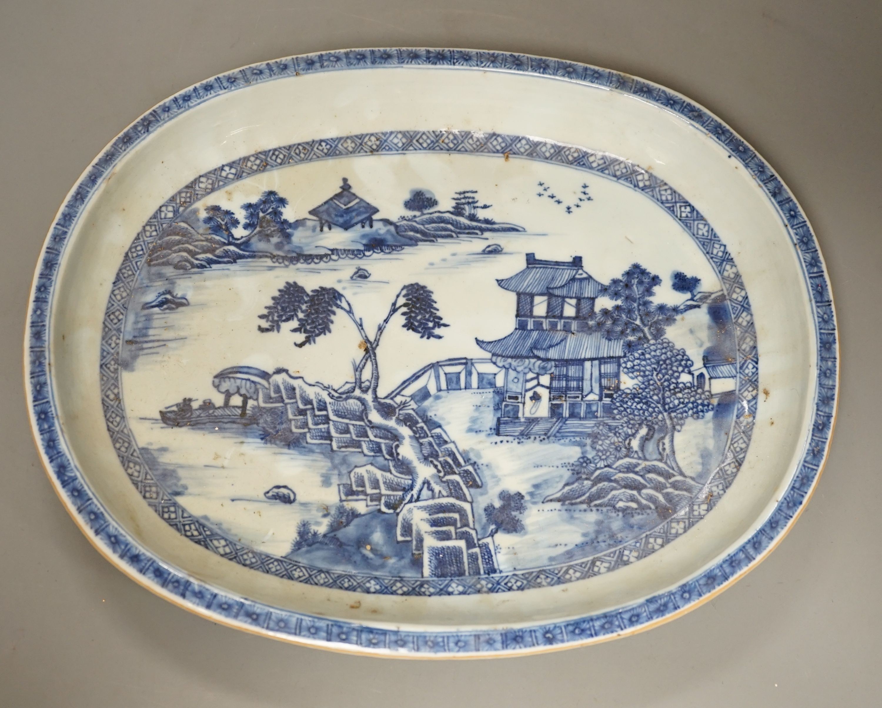An 18th century Chinese export oval blue and white dish, 32cm.